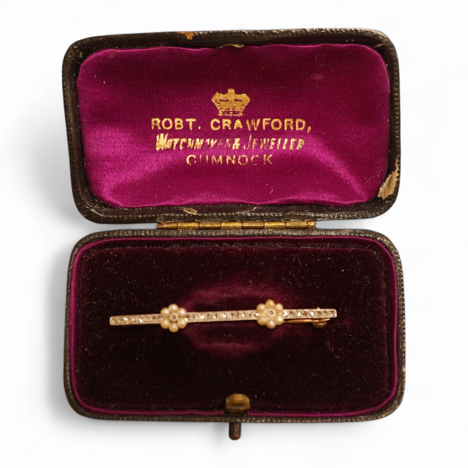 An Edwardian yellow metal, seed pearl and millegrain set diamond bar brooch, 51mm, gross weight 2.9 grams.
